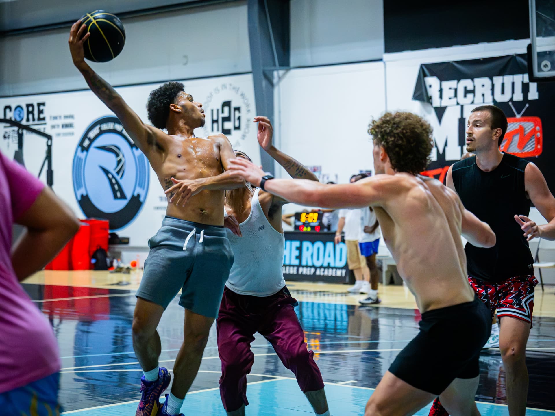 Kings player finishing through contact at the rim